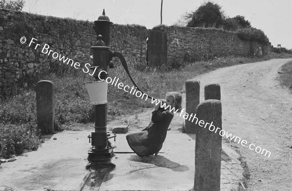 CHILD AT WATER PUMP